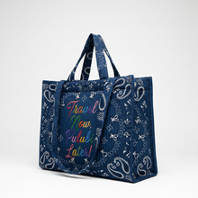 Görseli Galeri görüntüleyiciye yükleyin, A navy blue tote bag with a white paisley bandana print and colorful embroidered text reading 'Travel Now, Pulubi Later!' on the front, shown against a plain white background.
