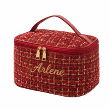 Carica l'immagine nel visualizzatore di Gallery, A red tweed cosmetic bag with gold and black woven details, featuring a top handle, gold-tone zipper pulls, and a zippered closure, shown on a plain white background.
