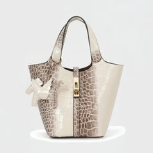 Cargar imagen en el visor de la galería, Croc Luxe handbag with crocodile embossed pattern on a white background
