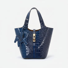 Carica l'immagine nel visualizzatore di Gallery, Blue crocodile-patterned handbag with a gold zipper on a white background
