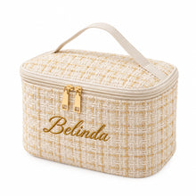 Carica l'immagine nel visualizzatore di Gallery, A personalized beige tweed cosmetic bag with a top handle, gold zipper pulls, and the name 'Belinda' embroidered in black script on the front, set against a plain white background.
