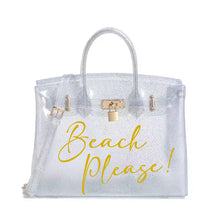 Load image into Gallery viewer, Clear personalized Beachkin tote bag with gold lock and yellow Beach Please text by Travellers Hat Boutique
