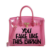 Load image into Gallery viewer, Pink transparent personalized Beachkin tote bag with black text and gold lock from Travellers Hat Boutique
