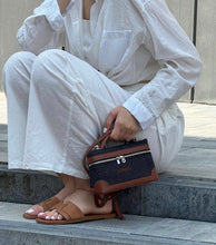 Cargar imagen en el visor de la galería, Custom square denim purse with brown leather accents held by woman wearing white outfit and brown sandals
