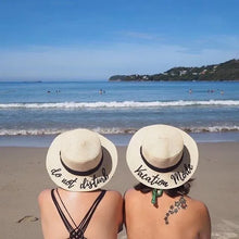 Carica l'immagine nel visualizzatore di Gallery, Two women wearing custom embroidered round hats with beach and ocean background at a sunny beach

