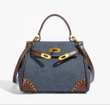 Cargar imagen en el visor de la galería, Travellers Hat Boutique retro denim handbag tote bag with brown leather handles and gold-tone hardware
