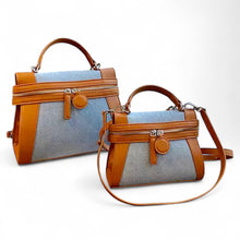 Cargar imagen en el visor de la galería, Travellers Hat Boutique retro denim handbag tote bag with brown leather trim and zippered compartments
