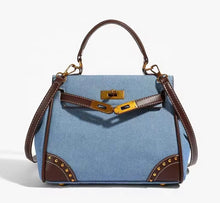Cargar imagen en el visor de la galería, Retro denim handbag tote bag with brown leather handles and gold hardware from Travellers Hat Boutique
