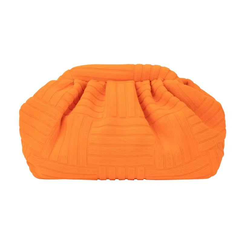 Bright orange textured clutch bag from Travellers Hat Boutique with ruched design