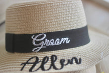 Cargar imagen en el visor de la galería, Custom prenuptial hat set featuring a beige woven hat with black band embroidered with Groom and Allen
