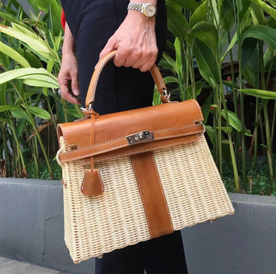 Handmade wicker purse for women with tan leather trim and top handle tote bag from Travellers Hat Boutique