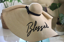 Load image into Gallery viewer, Oversized straw sun hat with black ribbon and Blessed embroidery by Travellers Hat Boutique
