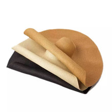 Load image into Gallery viewer, Stack of oversized straw sun hat in tan beige and black from Travellers Hat Boutique
