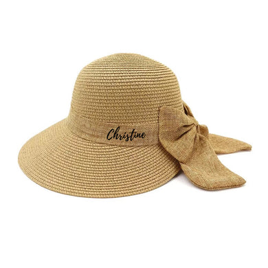 Personalized straw hat for women with wide brim and bow from Travellers Hat Boutique