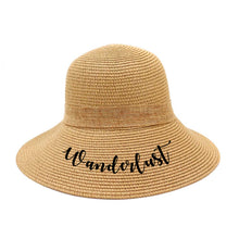 Cargar imagen en el visor de la galería, Personalized straw hat for women with Wanderlust text in black script by Travellers Hat Boutique
